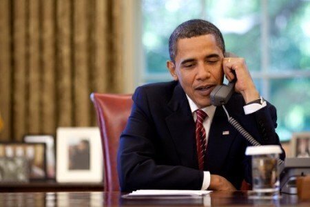 President Barack Obama talks on the telephone to the crew of the Space Shuttle Atlantis from the Oval Office, Wednesday, May 20, 2009. Official White House photo by Pete Souza.