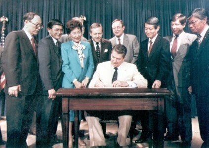 President Reagan signs the act reagansignsact