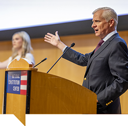 Jon Meacham talking with a speaker at a Town Hall event