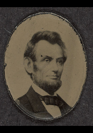 political campaign button for presidential election with head-and-shoulders portrait of Abraham Lincoln. Photo by Mathew Brady, 1864