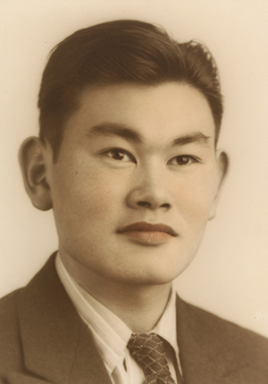 Hand-colored gelatin silver print of Fred T. Korematsu, head-and-shoulders portrait, by unidentified artist, 1940.