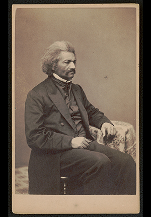 Photograph by B.F. Smith and Son of Frederick Douglass, three-quarter length portrait, seated, 1864.