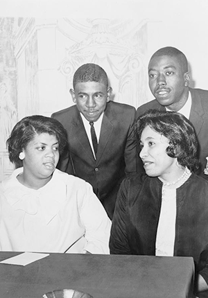 Linda Brown Smith, Ethel Louise Belton Brown, Harry Briggs, Jr., and Spottswood Bolling, Jr. during press conference at Hotel Americana.
