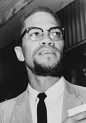 Malcolm X, head-and-shoulders portrait, facing right, 1964.