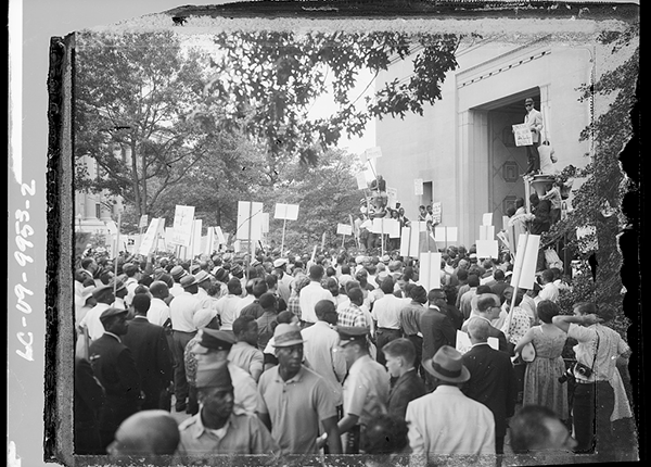 African Americans at a demonstration organized by the Congress of Racial Equality (CORE) against discrimination and in response to the death of Medgar Evers in front of the Department of Justice, Washington, D.C.