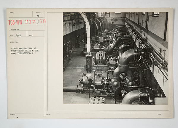 Off-white file card with photo of industrial space and typed description: 'steel manufacture at Youngstown Sheet and Tube Co., Youngstown, O.', 1918.